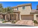 Attractive two-story home with a two-car garage and tiled roof on a sunny day at 9326 Noble Sage Ave, Las Vegas, NV 89148