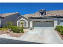 Charming single-story home featuring a well-maintained front yard and an attached two-car garage at 9724 Canyon Walk Ave, Las Vegas, NV 89147