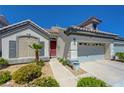 Charming single-story home featuring a well-maintained front yard and an attached two-car garage at 9724 Canyon Walk Ave, Las Vegas, NV 89147