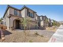Charming two-story home featuring an attached garage and a beautifully paved driveway at 10933 Sageview Ave, Las Vegas, NV 89166