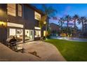 Stunning backyard with a view of the pool, lush lawn, and an outdoor dining area, perfect for entertaining guests at 3924 Diamond Ridge St, Las Vegas, NV 89129