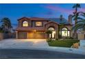 Charming two-story home with a three-car garage, well-maintained lawn, and beautiful stone accents at 3924 Diamond Ridge St, Las Vegas, NV 89129
