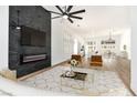 Open-concept living area with black marble fireplace and stylish furnishings at 4117 Sinew Ct, Las Vegas, NV 89129