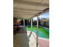 Covered outdoor space with pool, and patio perfect for entertaining guests at 5317 Holmby Ave, Las Vegas, NV 89146