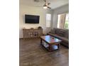 Comfortable living room features modern tile flooring, neutral decor, and plenty of natural light at 5466 Scotch Cap Dr, Las Vegas, NV 89122