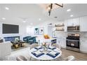 Modern living space with a fireplace, open to a stylish kitchen and dining area, perfect for entertaining at 6170 W University Ave, Las Vegas, NV 89103