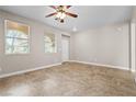Comfortable bedroom with tile flooring, natural light, and a neutral color palette at 6743 Windingwood St, Las Vegas, NV 89148