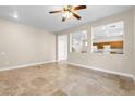 Spacious living area featuring tile flooring and a bright, open layout at 6743 Windingwood St, Las Vegas, NV 89148