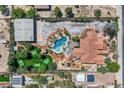 A captivating aerial view of an estate with a pool, putting green, large building and serene landscaping at 7760 Haven St, Las Vegas, NV 89123