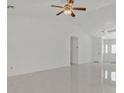Spacious living room featuring vaulted ceilings, tile floors, and an inviting atmosphere at 7925 Placid St, Las Vegas, NV 89123