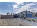 Home featuring a block wall, RV parking, desert landscaping, and a paver walkway leading to the house at 7938 Jessamy St, North Las Vegas, NV 89084