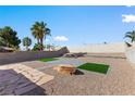 Expansive backyard featuring a spacious patio area and desert landscaping at 7957 Lovely Pine Pl, Las Vegas, NV 89143