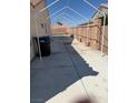 Concrete side yard with a metal frame canopy on one side at 807 Airy Hill St, Henderson, NV 89015