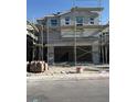 New two-story home featuring a multi-car garage and classic architecture under construction at 9095 Rivington Ave, Las Vegas, NV 89148
