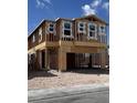 Two-story home under construction featuring a spacious garage and modern window design at 9095 Rivington Ave, Las Vegas, NV 89148