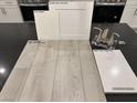 This kitchen features white cabinets, stainless steel appliances, and quartz countertops at 9095 Rivington Ave, Las Vegas, NV 89148
