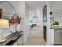 Stylish entryway with neutral decor leading into the bright living room at 9157 Acclamation Ct, Las Vegas, NV 89149