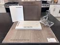 Selections include a modern faucet, quartz countertops, stainless steel appliances, and neutral color palette at 9233 Hudson Yards Ct, Las Vegas, NV 89148
