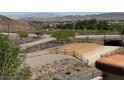 This picturesque mountain view features desert landscaping, a pedestrian tunnel and mountains in the background at 96 Saint Johns Wood Ave, Henderson, NV 89002