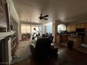 The open floor plan features hardwood floors and seamlessly connects the living room and kitchen at 9628 Scrub Jay Ct, Las Vegas, NV 89148