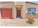 Inviting front entrance features brick-paved walkway, covered porch, and modern fixtures at 10266 Sweet Holly Pl, Las Vegas, NV 89149