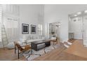 Bright, open living room with high ceilings and modern decor, next to the entryway at 10729 Grey Havens Ct, Las Vegas, NV 89135