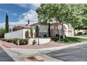 View of the corner lot, showcasing its landscaping, sidewalks, and street sign at 1116 Piazza Telle, Henderson, NV 89052