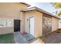 Exterior view of home featuring stone landscaping and walkway to the front door at 208 N Bruce St # A, Las Vegas, NV 89101