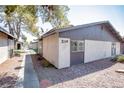 Exterior view of home featuring stone landscaping and shaded walk way at 208 N Bruce St # A, Las Vegas, NV 89101