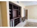 Living room featuring a large built-in entertainment center, providing ample storage and display space at 2153 Jade Creek St # 106, Las Vegas, NV 89117