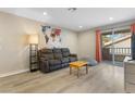 Cozy living room with modern furnishings, slider to balcony, and lots of natural light at 2606 S Durango Dr # 260, Las Vegas, NV 89117