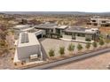 This home includes modern architecture, solar panels, and a spacious driveway offering a contemporary living experience at 3 Horseshoe Rock Ct, Henderson, NV 89012