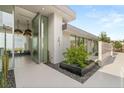 This home features a modern entryway with sleek planters and stylish lighting, creating an inviting and elegant entrance at 3 Horseshoe Rock Ct, Henderson, NV 89012