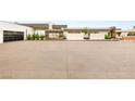 Expansive motor court showcasing the contemporary architecture of the home at 3 Horseshoe Rock Ct, Henderson, NV 89012