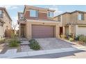 Charming home boasts a paved driveway, neat landscaping, and a welcoming two-story facade at 354 Spotted Dove St, Las Vegas, NV 89138