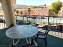 Balcony with a table and chairs overlooking the parking and the mountains at 3550 Bay Sands Dr # 3001, Laughlin, NV 89029