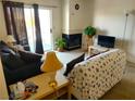 Inviting living room with a fireplace, sofa, and sliding glass door to the balcony at 3550 Bay Sands Dr # 3001, Laughlin, NV 89029