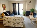Cozy living room featuring a fireplace, couch, and sliding door to the outside at 3550 Bay Sands Dr # 3001, Laughlin, NV 89029