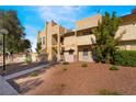 Charming exterior with well-manicured landscape and a mix of green shrubs, trees, and rock for a striking look at 3937 S Torrey Pines Dr, Las Vegas, NV 89103
