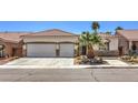 Charming single-story home with desert landscaping, two-car garage, and stone accents at 7489 Crystal Clear Ave, Las Vegas, NV 89113