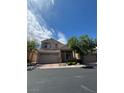 Charming two-story home featuring a well-manicured front yard and a spacious two-car garage at 7589 Grassy Bank St, Las Vegas, NV 89139