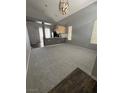 Bright living room with high ceilings, flowing into the modern kitchen at 7589 Grassy Bank St, Las Vegas, NV 89139