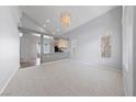 Spacious living area with vaulted ceiling, recessed lighting, and open floor plan at 7589 Grassy Bank St, Las Vegas, NV 89139