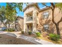 Exterior view showcasing the building's architecture and manicured landscaping at 8000 Badura Ave # 1058, Las Vegas, NV 89113