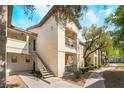 Apartment building with multiple units, stair access, and well-kept grounds at 8000 Badura Ave # 1058, Las Vegas, NV 89113