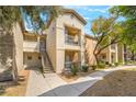 Well-maintained apartment complex with staircase access and mature trees at 8000 Badura Ave # 1058, Las Vegas, NV 89113