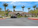 Horizons at Seven Hills community entrance featuring mature trees, landscaping, and community building at 950 Seven Hills Dr # 2313, Henderson, NV 89052