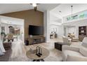 Spacious living room featuring an open floor plan, with wood-look floors and lots of natural light at 9540 Eagle Valley Dr, Las Vegas, NV 89134