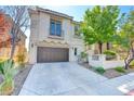 Charming two-story home with a well-manicured front yard and a two-car garage at 11833 Amistoso Ln, Las Vegas, NV 89138