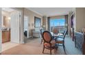 Comfortable living space with ample light, mountain views, and a full bath visible in the background at 135 E Harmon Ave # 3620, Las Vegas, NV 89109